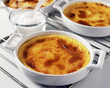 Taking the creme brulée out of the oven