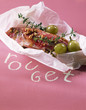 Red mullet with thyme and grapes cooked in wax paper