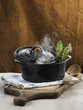 Cast iron casserole dish and steam