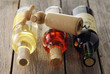 Assorted bottles of wine and corkskrew