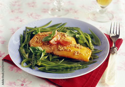 Photo: Half-cooked piece of salmon caramelized with soya sauce,honey,sesame seeds and sugar peas Half-cooked piece of salmon caramelized with soya sauce,honey,sesame seeds and sugar peas