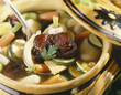 Hare cooked in wine with young vegetables