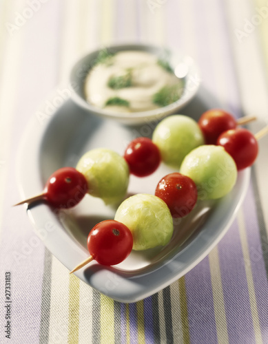 Photo: Cucumber balls and cherry tomato brochettes with dip Cucumber balls and cherry tomato brochettes with dip