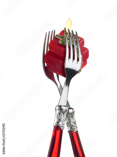 Photo: Two forks with present-shaped candle Two forks with present-shaped candle