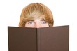 Young handsome man hiding behind the book