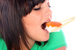 Young Woman Eating Sushi