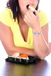 Young Woman Eating Sushi