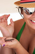 Woman Holding a Tropical Lizard