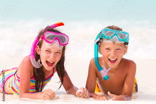 Photo: Happy boy and girl on beach Happy boy and girl on beach