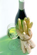 glass and bottle of white wine with asparagus