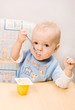 baby eating yoghurt