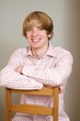 Young handsome man sitting on a chair