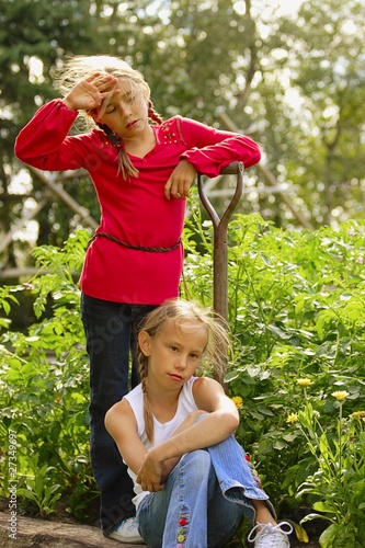 Photo: Two Girls Resting From Garden Work Two Girls Resting From Garden Work