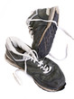 Old grungy Running Shoes isolated