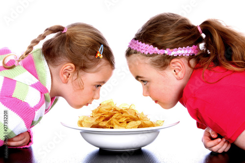 Photo: Children with Bowl of Crisps.Models Released Children with Bowl of Crisps.Models Released