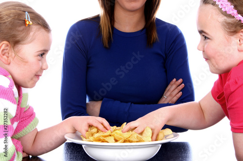 Photo: Children Eating Crisps.Models Released Children Eating Crisps.Models Released