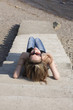 Beautiful brunet woman lying on the steps near the river Beautiful brunet woman lying on the steps near the river