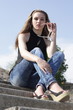 Pretty Lovely brunette girl sitting on the stairs Pretty Lovely brunette girl sitting on the stairs