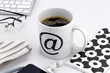 Cup of coffee with at symbol
