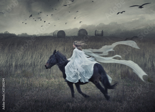 Photo: Romantic young beauty riding a horse Romantic young beauty riding a horse
