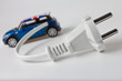 little blue car and white electrical plug