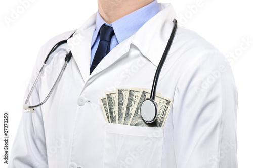 Photo: A portrait of a male doctor with money in his pocket A portrait of a male doctor with money in his pocket