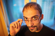 Portrait of handsome young adult man in glasses