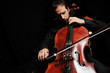Cellist playing classical cello music on black background