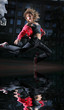 Photo: Modern female dancer jumping in city at night Modern female dancer jumping in city at night