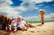 identical twin boys relaxing on a beach identical twin boys relaxing on a beach