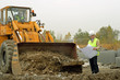 Photo: Excavator and architect. Excavator and architect.