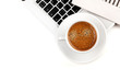 Cappuccino cup on laptop. Above view Cappuccino cup on laptop. Above view