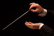 Foto: Conductor conducting an orchestra Conductor conducting an orchestra
