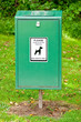 Photo: Close Up of Bright Green Dog Mess Poop Bin with Label Close Up of Bright Green Dog Mess Poop Bin with Label