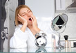 woman applying makeup