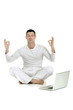 Photo: man dressed in white sitting on the floor with laptop man dressed in white sitting on the floor with laptop