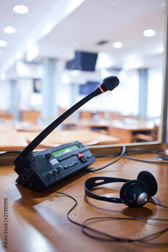 Photo: interpreting - Microphone and switchboard in an simultaneous int interpreting - Microphone and switchboard in an simultaneous int