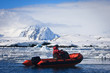 man in the red boat