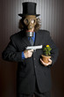 Businessman wearing a gasmask holding a gun to a flower