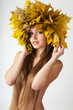 At the woman an autumn wreath on a head.