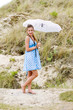 Fashion girl blue polka dress and umbrella