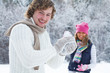 Couple playing snowballs
