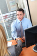 Woman meeting financial adviser in office Woman meeting financial adviser in office