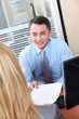 Woman meeting financial adviser in office Woman meeting financial adviser in office