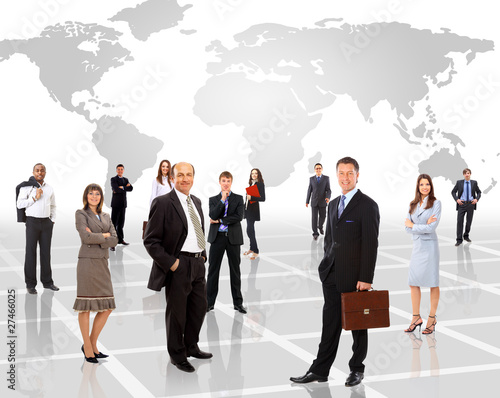 Photo: Businessmen standing in front of an earth map Businessmen standing in front of an earth map