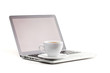 Cappuccino cup on laptop Cappuccino cup on laptop
