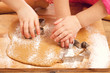 little girls cutting christmas gingerbread cookies, hands only little girls cutting christmas gingerbread cookies, hands only