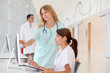 Photo: Nurse with intern working in front of computer Nurse with intern working in front of computer