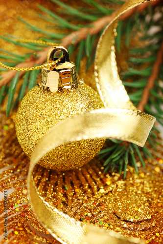 Photo: christmas balls with golden ribbon and tree christmas balls with golden ribbon and tree