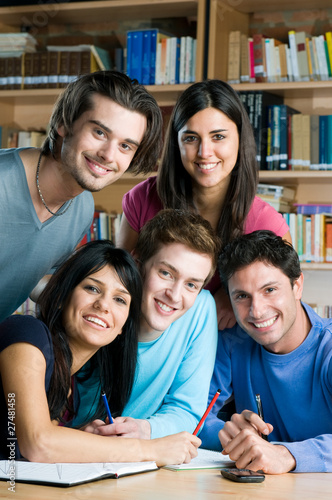 Photo: Happy students studying together Happy students studying together
